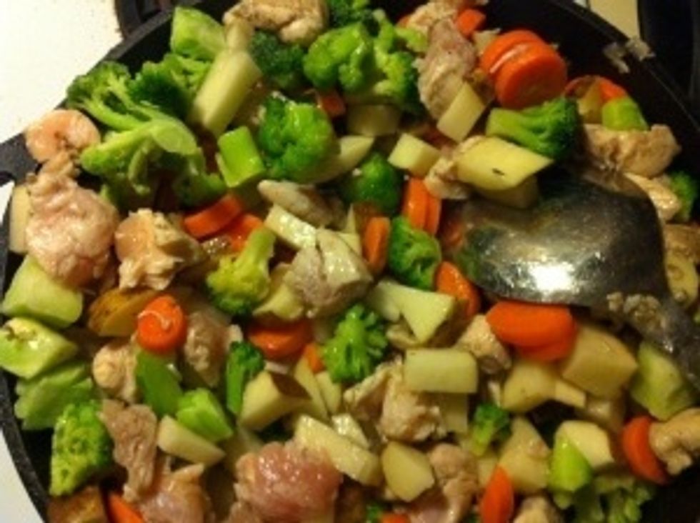 Next add the vegetable stock and the potatoes and the remaining ingredients and mix well.