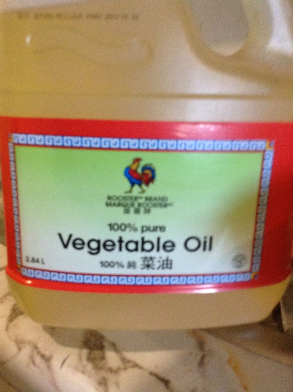 Next add vegetable oil in the pan add a lot so the chicken can broil in the BBQ spice and oil while roasting