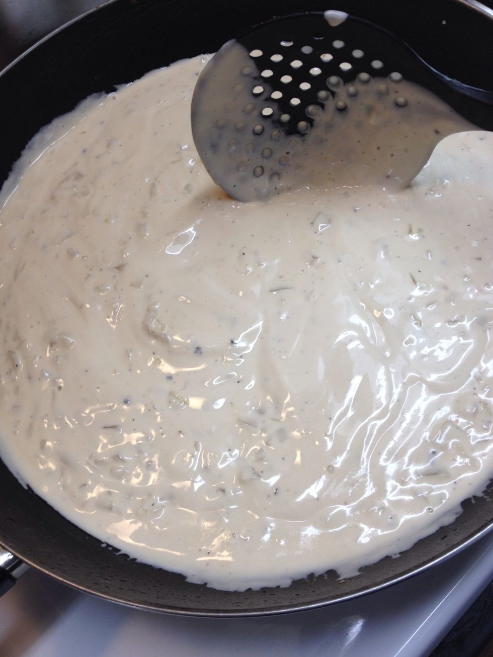 Next add your alfredo sauce. Then stir in chicken and let simmer.