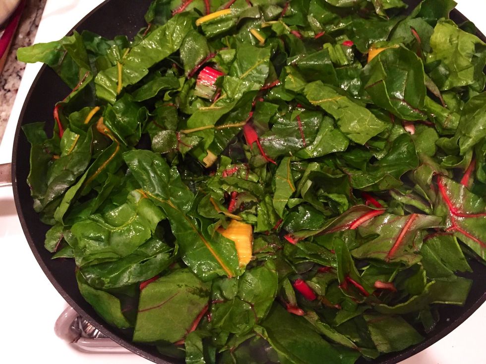 Next, add your roughly chopped rainbow chard and cook for another 3 minutes. Put about 1 Tbsp of water and cover to cook for another 2-3 minutes.