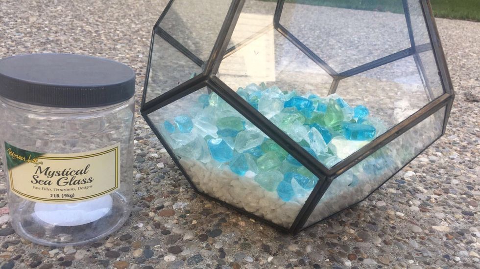 Next, add your second container of rocks (different from the first) into your pot on top of the rocks you put in on step 2.