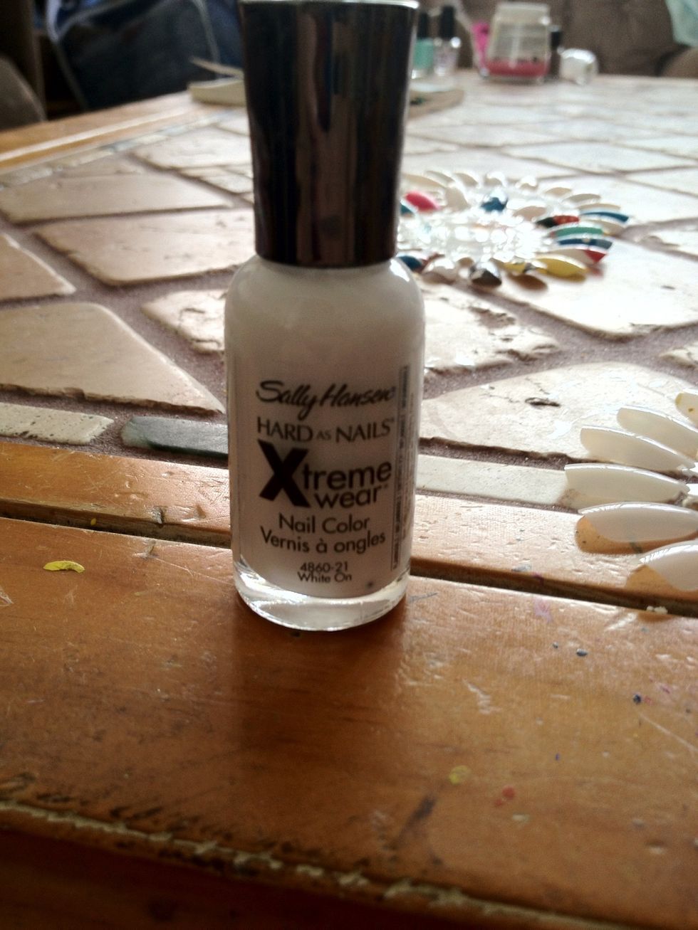 Next after your base coat dries. Put on white nail polish. I used Sally Hansen.