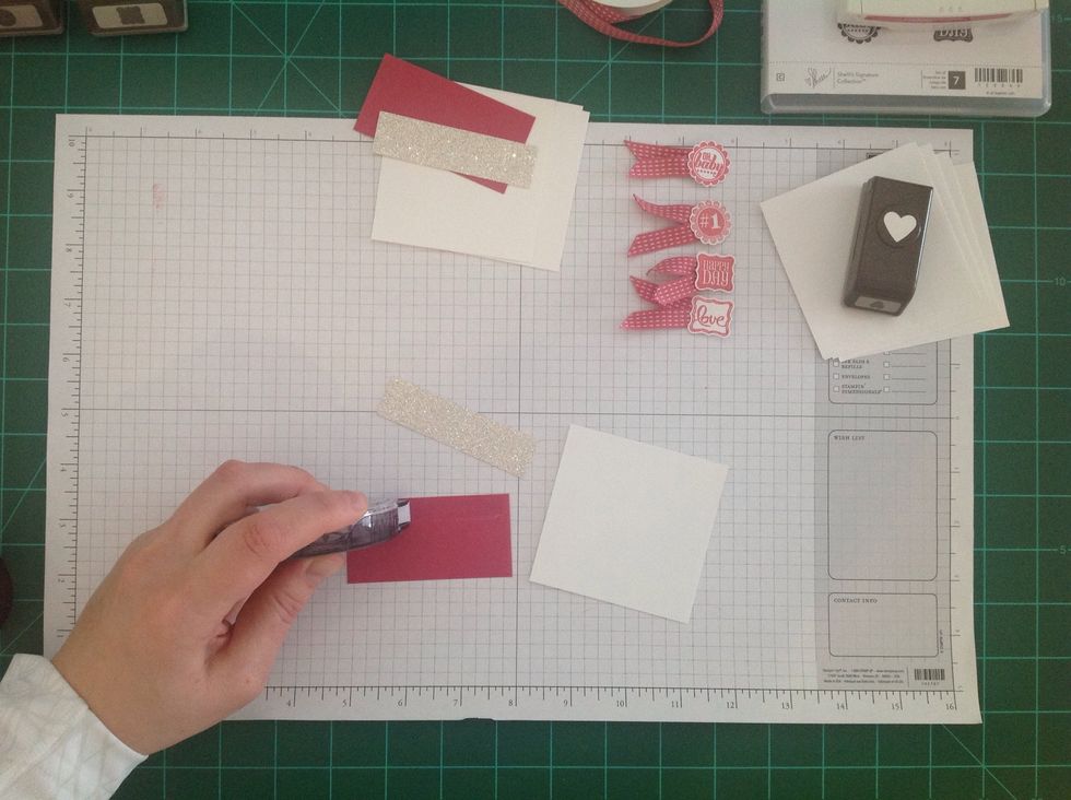 Next, apply adhesive to the top (long edge) of a 3" x 1 1/2" piece of Rose Red cardstock.