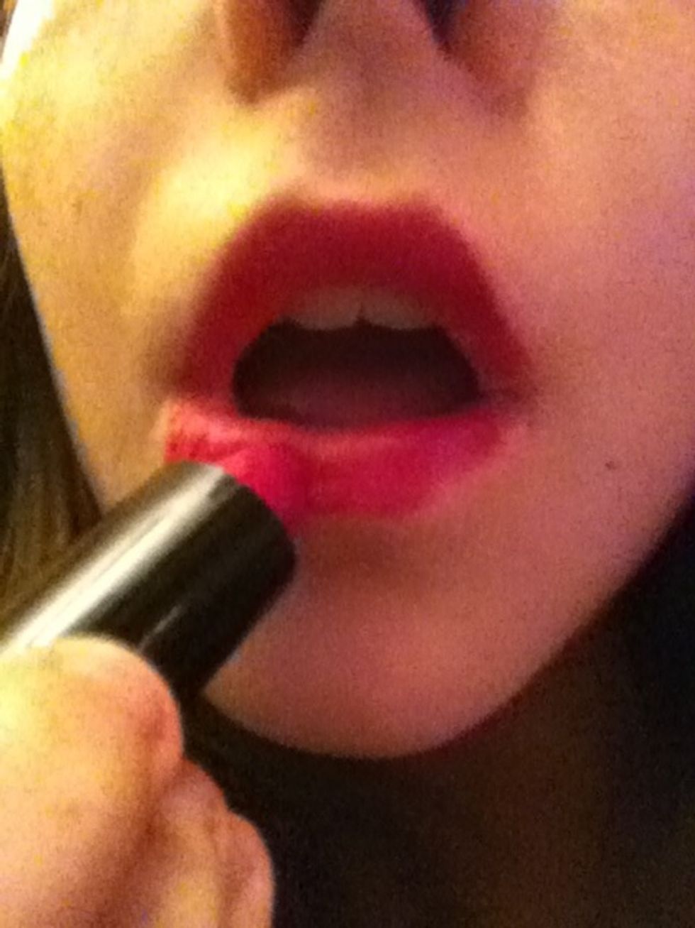 Next apply lipstick (dark colors work better if you don't have black lip stick use dark color and the next step will help)