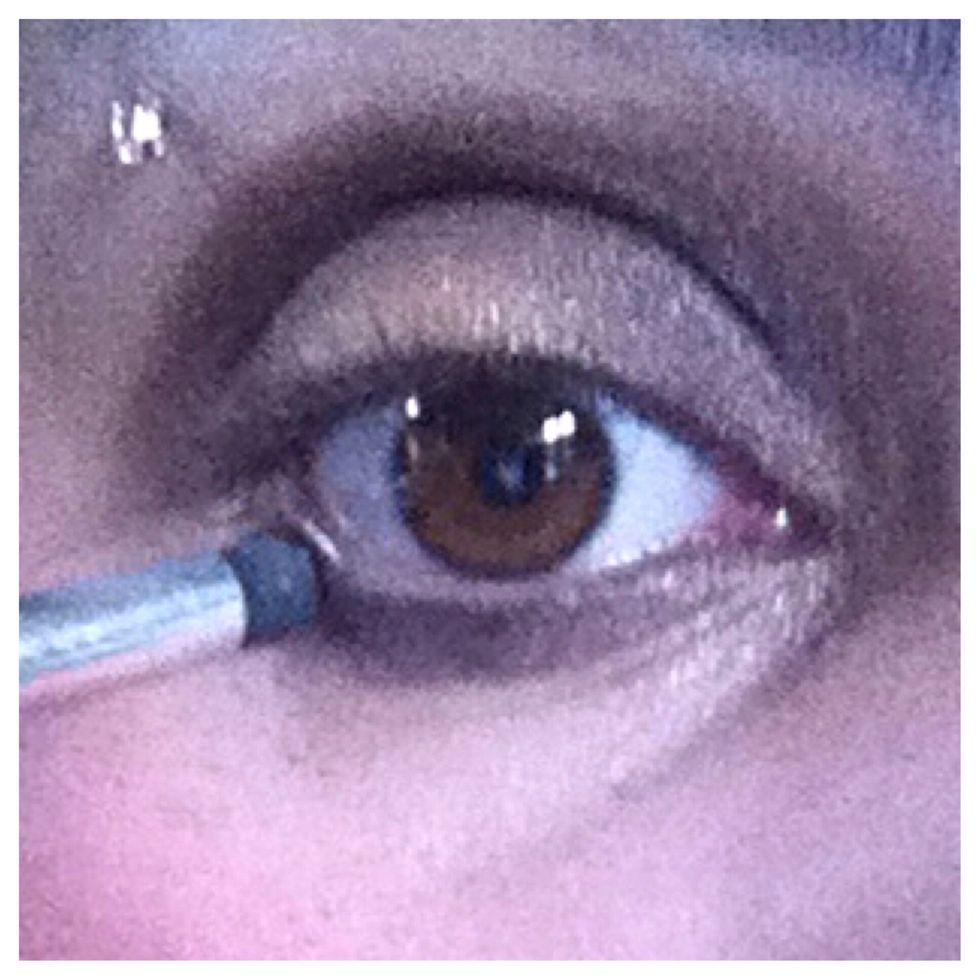 Next, apply the same dark brown shade onto your lower lash line.