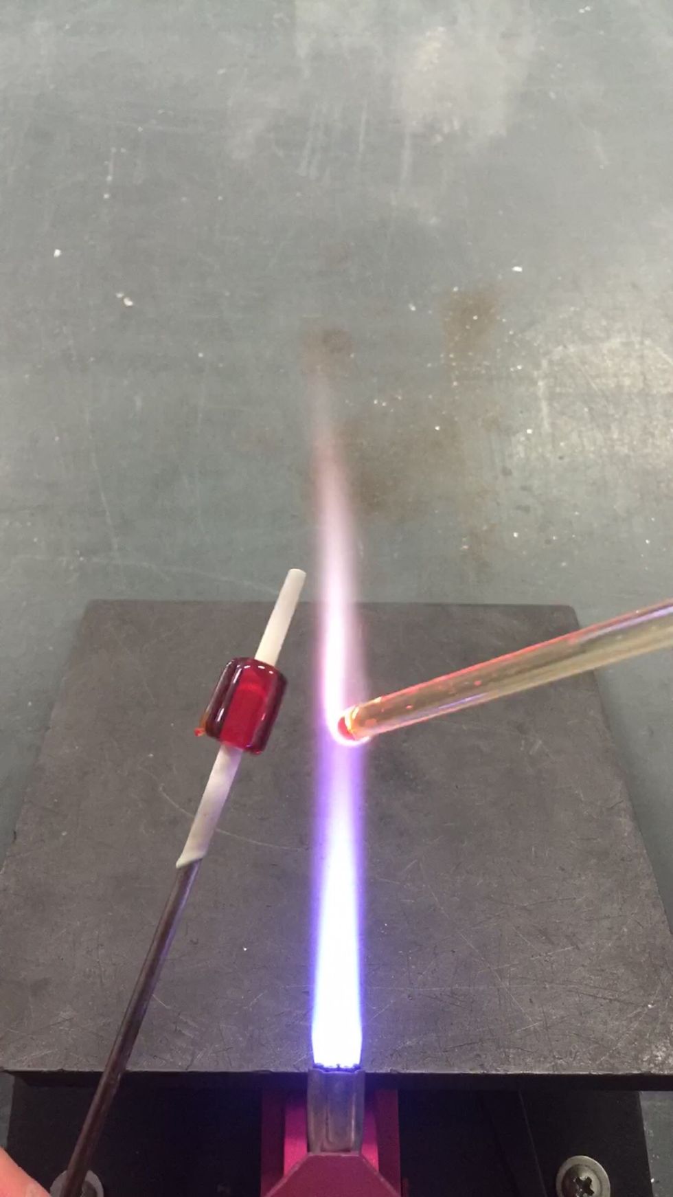 Next, apply thin stripes of Phoebe to the core. To keep it clean, turn up your oxygen a bit.