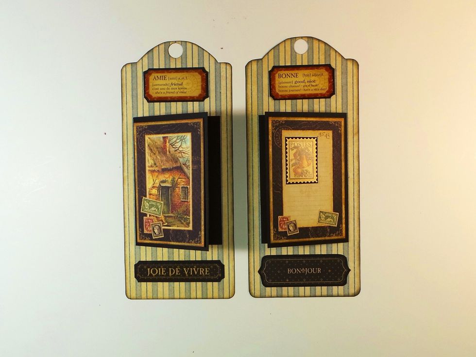 Next are tags with the folders we made in Step 42. Each has room for two 2x3 photos. The left one opens on the right; the right one opens on the left. Add other elements above and below the folders.