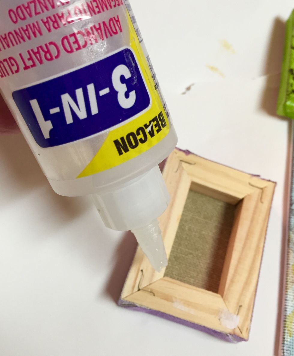 next, arrange and adhere mini canvases to 8 X 10 canvas using 3-in-1 Glue.
