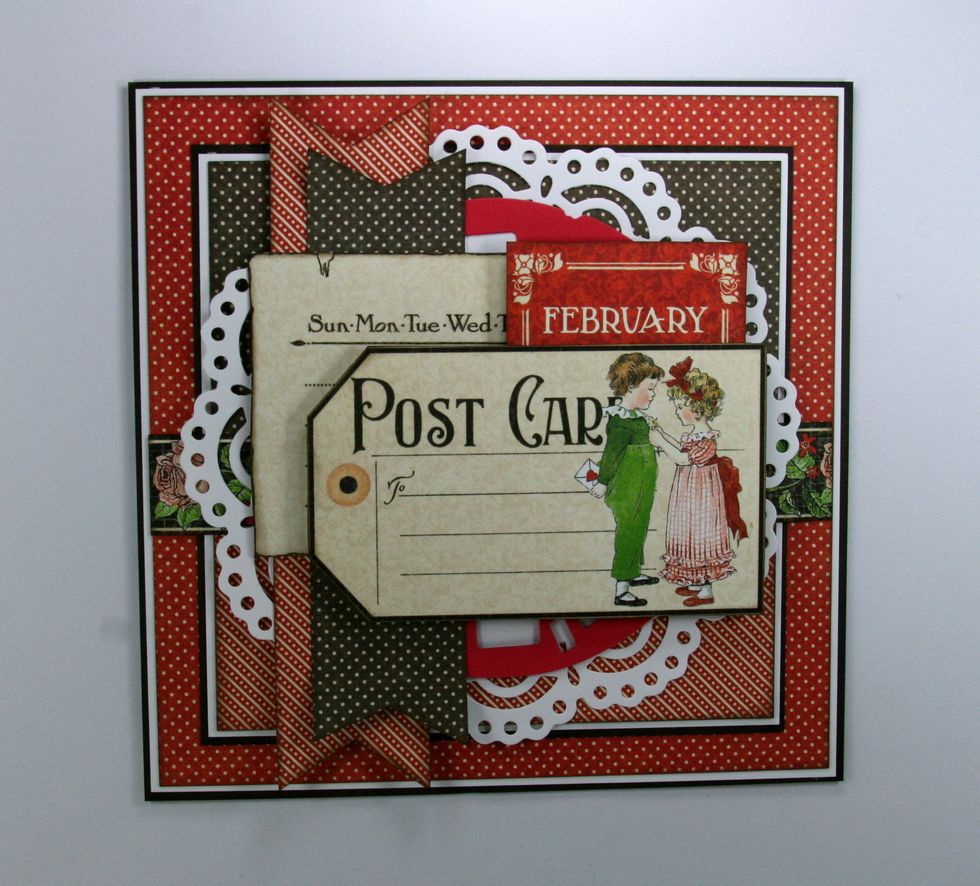Next attach the postcard image using more foam spacers.