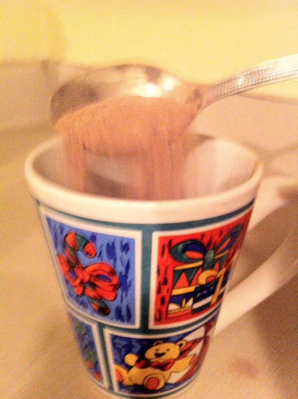 Next, before pouring anything into the cup, I put 3 tablespoons of hot chocolate mix into the cup (Some mixs may be different so be sure to follow the label on your mix and put in exact measurements)