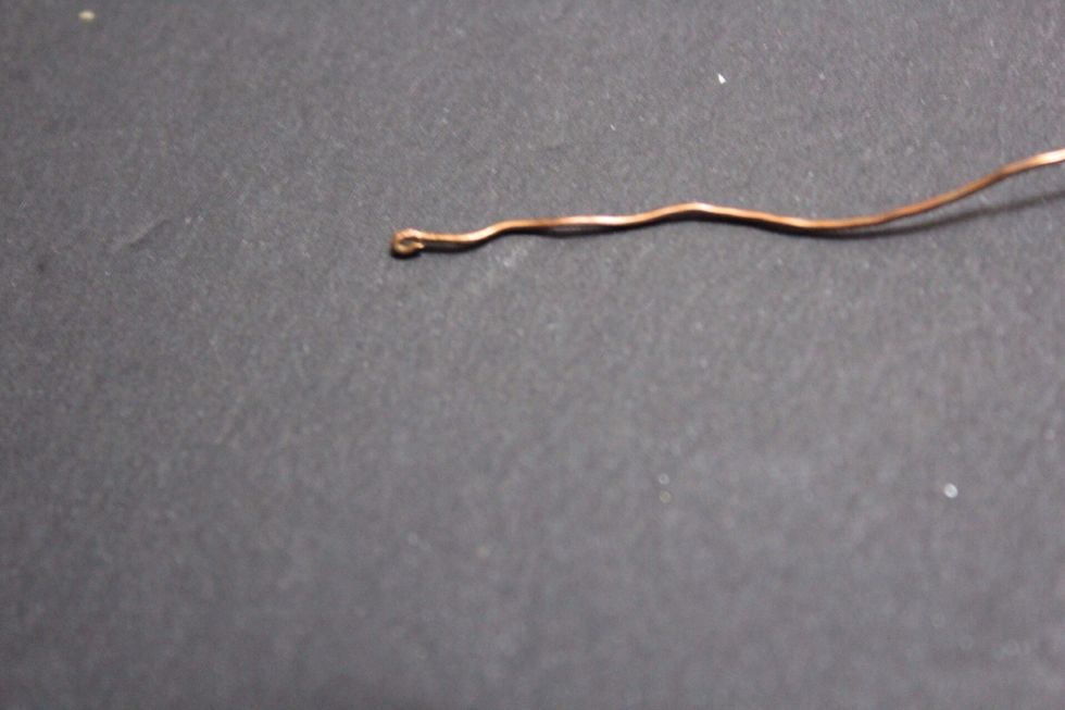 Next,bend the wire a little with pliers to form something like this.