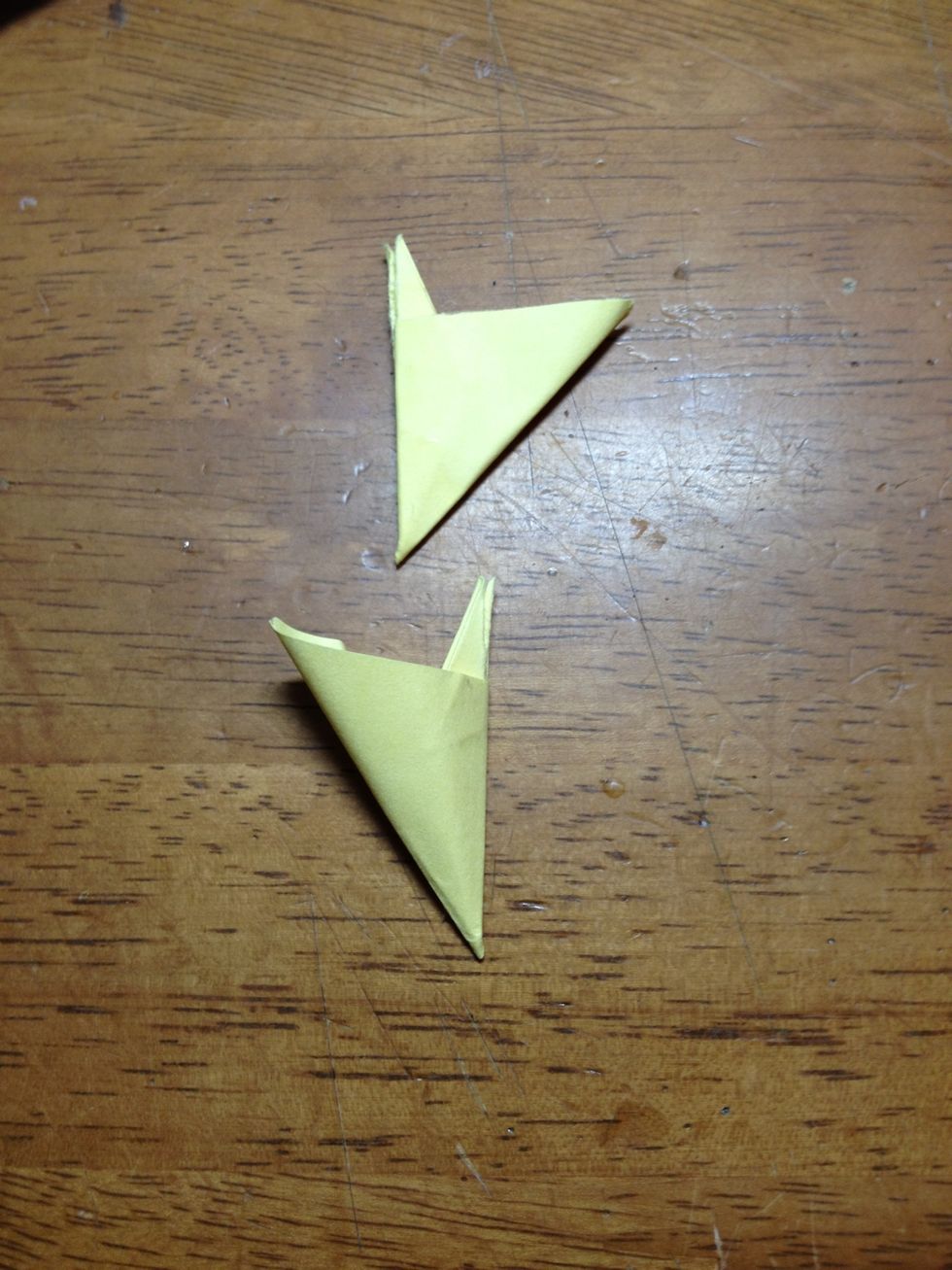 Next, bring both flaps together and press hard so that the glue sticks to both sides. Once that is done, push the center part to open up the back creating a flower petal.