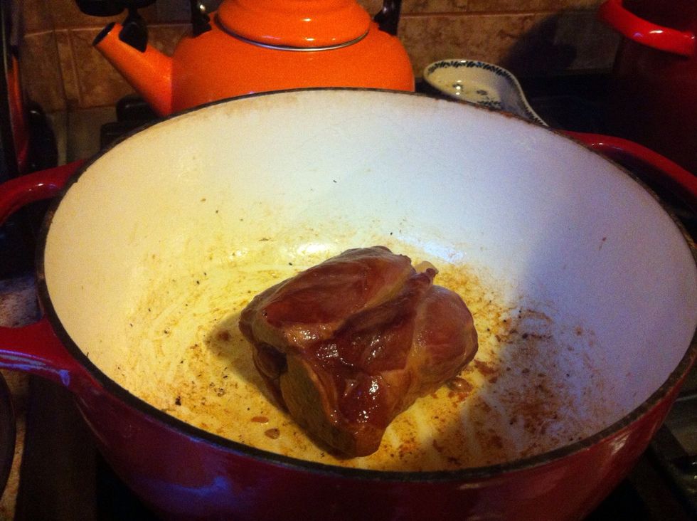 Next, brown the pork shank. About 2 minutes per side.