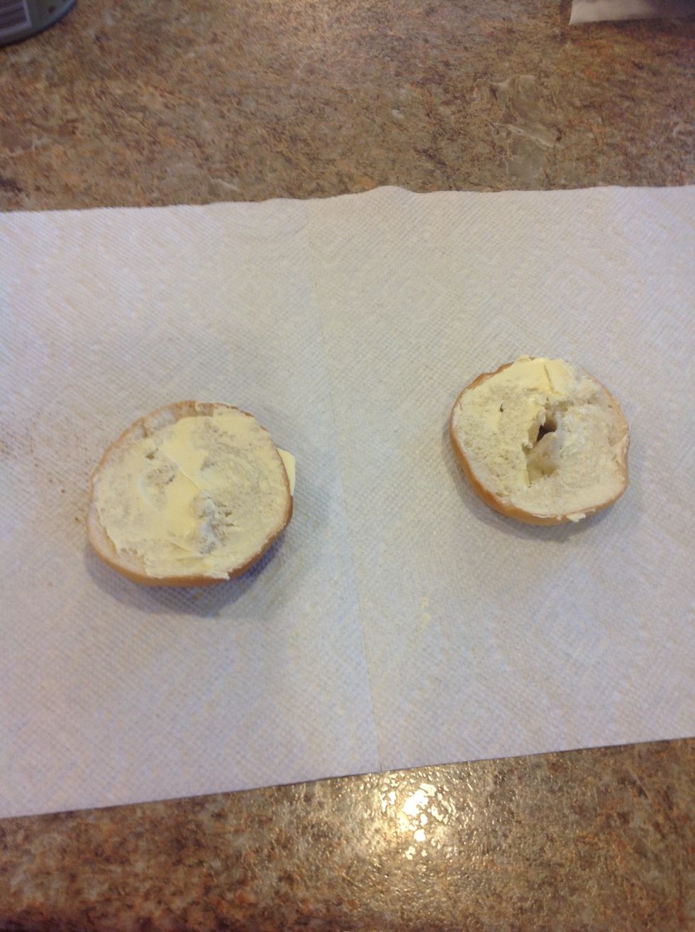 Next, butter both pieces of your bagel (try not to get globs of butter).