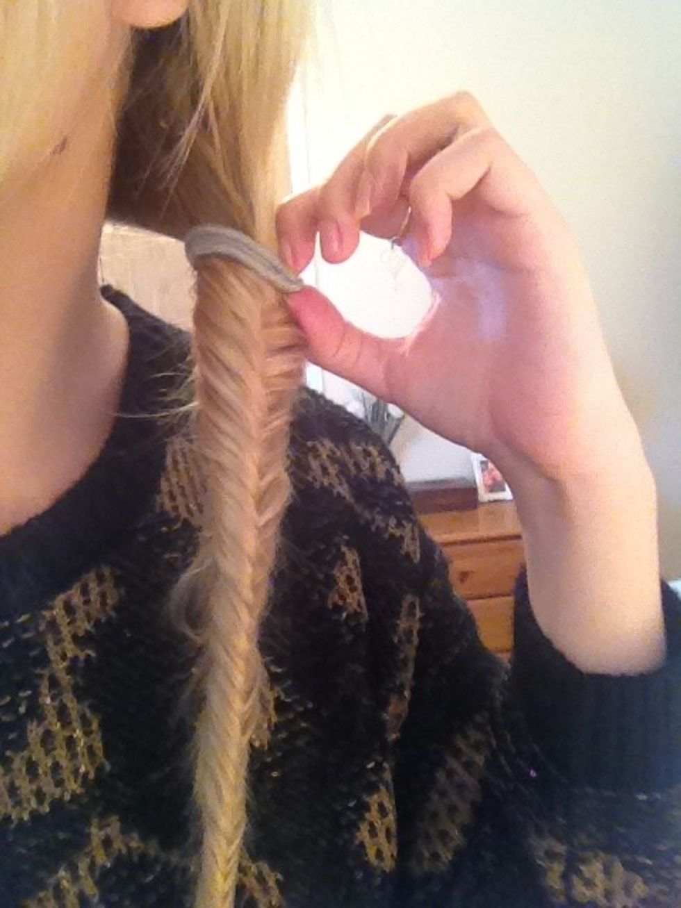 Next carefully pull out hairband at the top