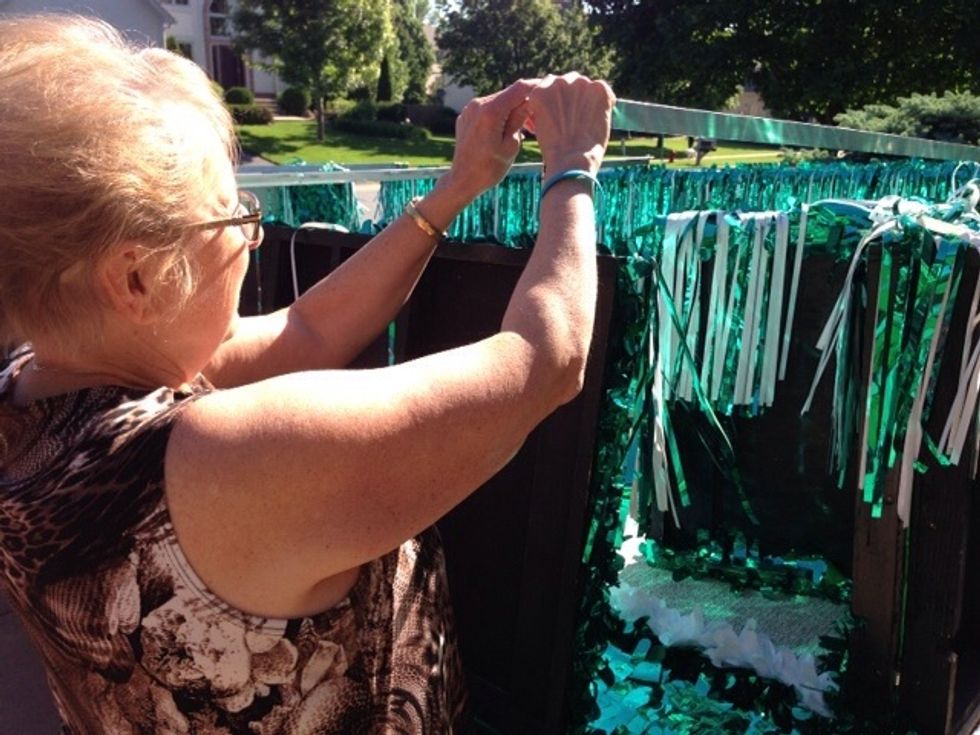 Next, carefully remove all three of the long metal bars that are on top of the float...