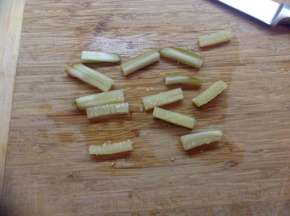 Next, chop a pickle slice into matchstick-width pieces about a half an inch long or so.