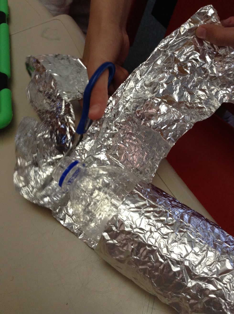 Next, chop of the excess foil with your scissors.