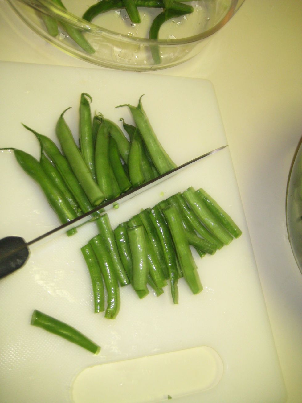 Next, Chop the beans in even or slanted cuts into halves or thirds. Depending on what you prefer.