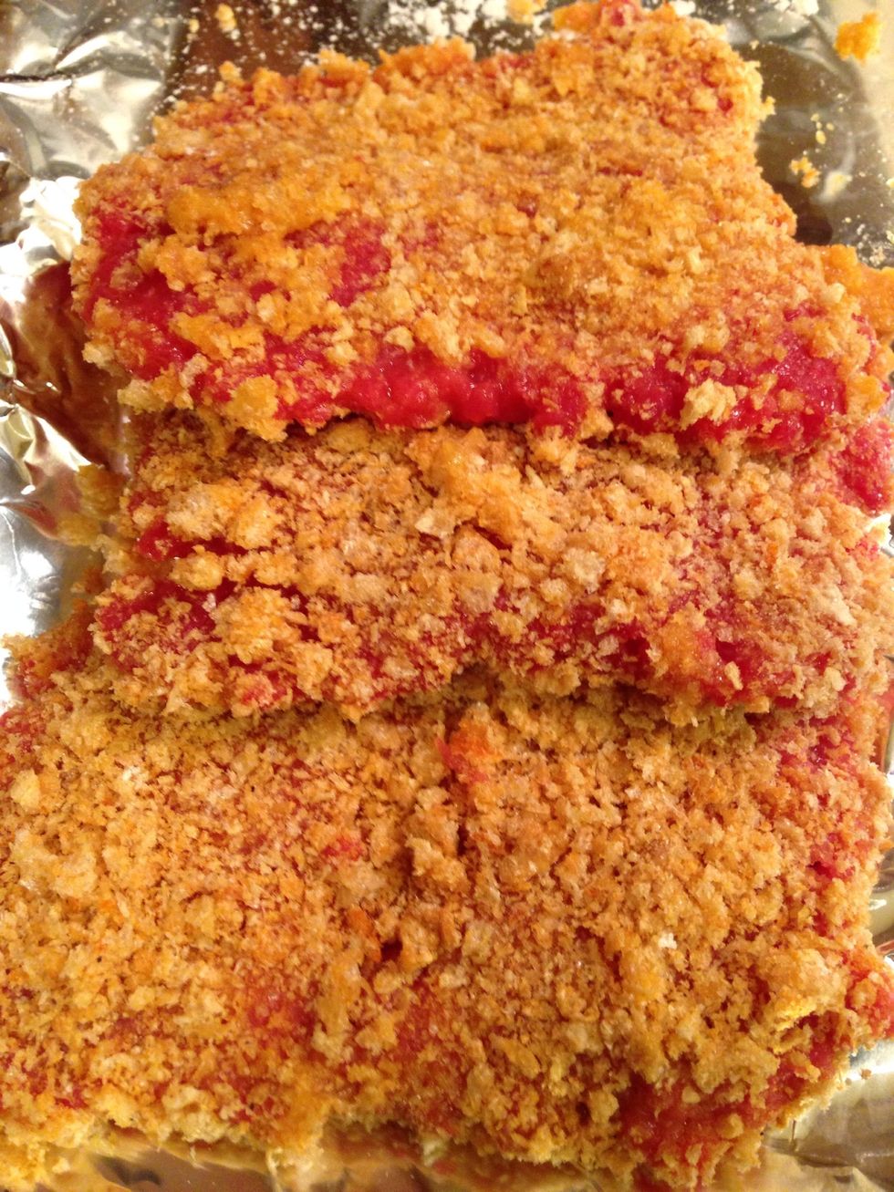 Next, coat them thoroughly with the crushed fried pork skins and set aside.