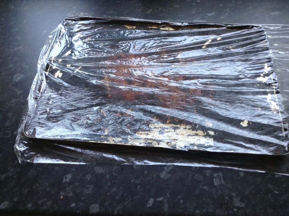 Next, cover it with cling film. You will need to do this even if your tray isn't as 'well worn' as mine or the bananas will stick. Don't cut it off yet though, it needs to fold over later on.