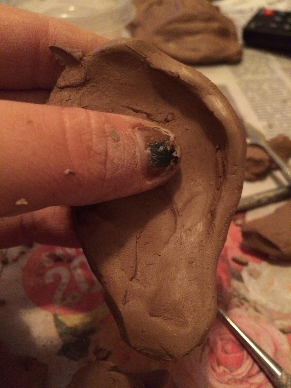 Next create a ridge on the side and top of the ear.