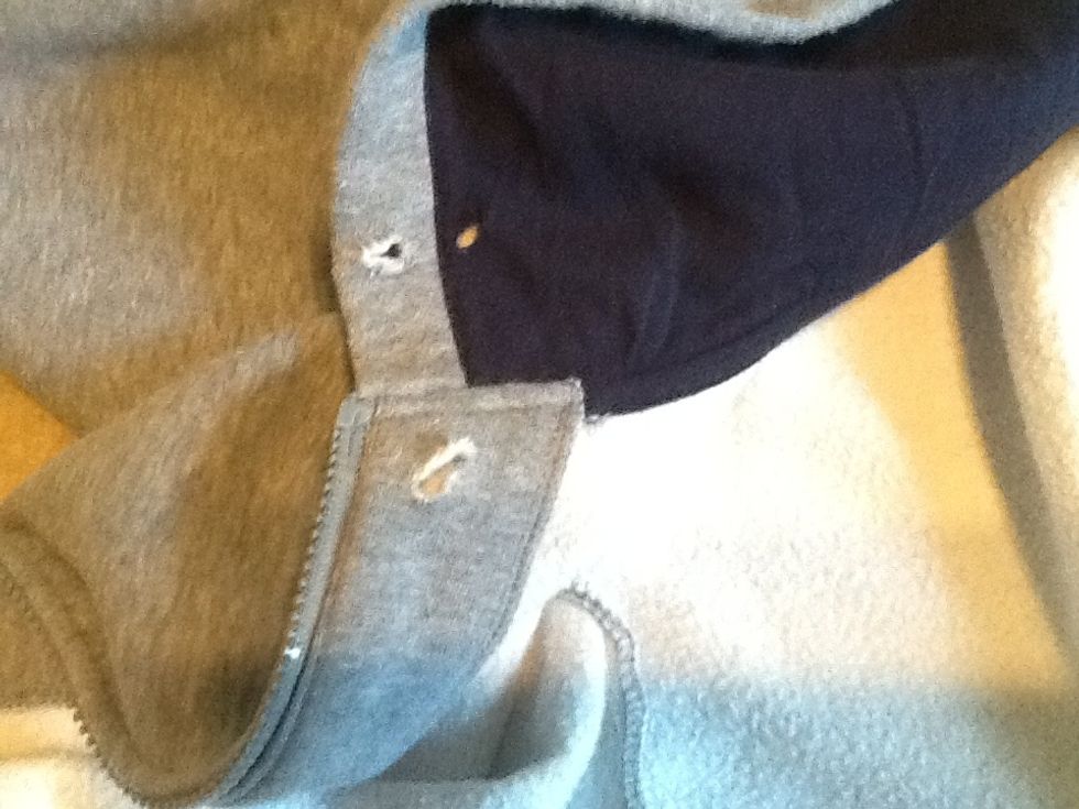 Next cut a hole coming from the same side as the pocket you cut into and then make a cut near the area that you will be pulling the headphone through, also make a cut in the roof part of the hood