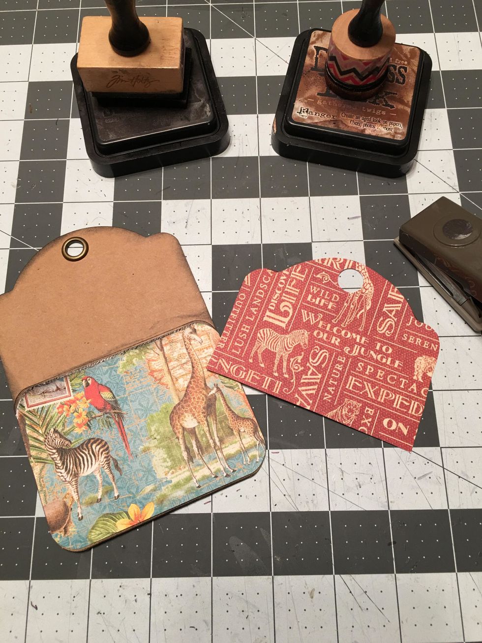 Next cut a piece of paper to match the top part of the tag. Make sure to punch out the circle for the grommet.