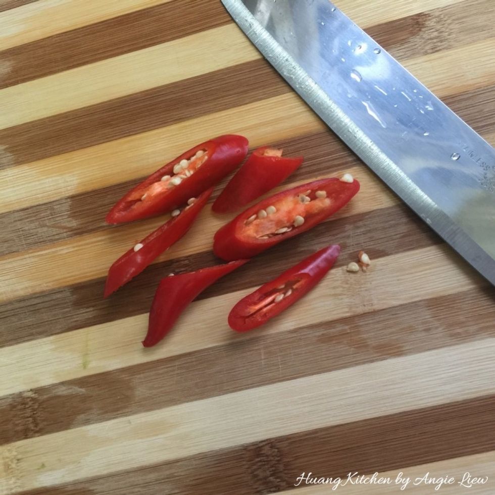 Next, cut a red chili into thick slices and set aside while we prepare the sauce.