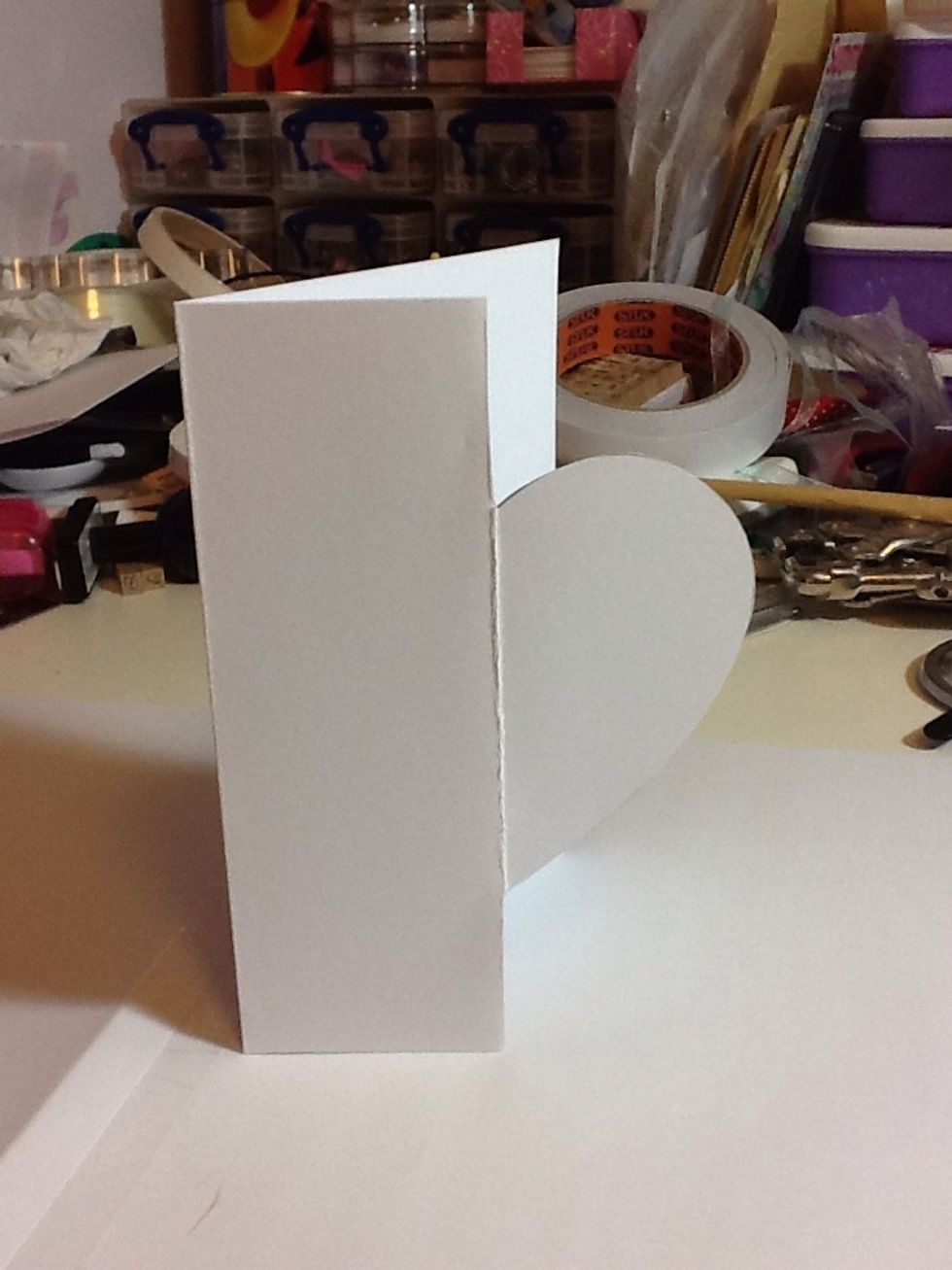 Next cut down and around the heart leaving that side with just half a heart (rub out any pencil lines)