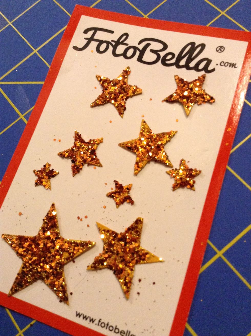 Next, cut out and glitter some stars.