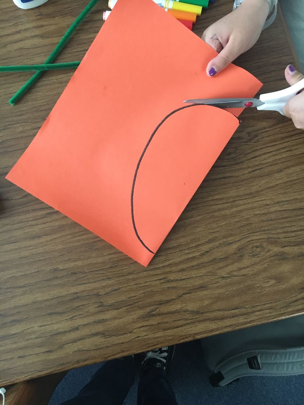 Next, Cut out the backwards "C" on the solid, black line.