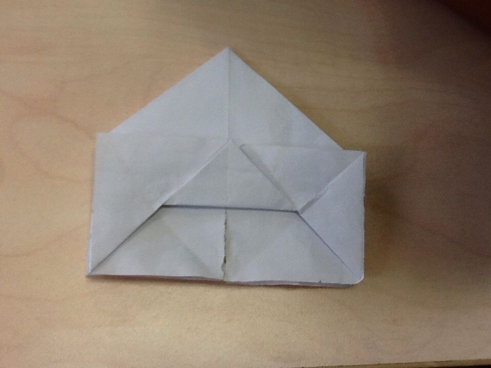 Next,cut the paper in half and cut the other side.