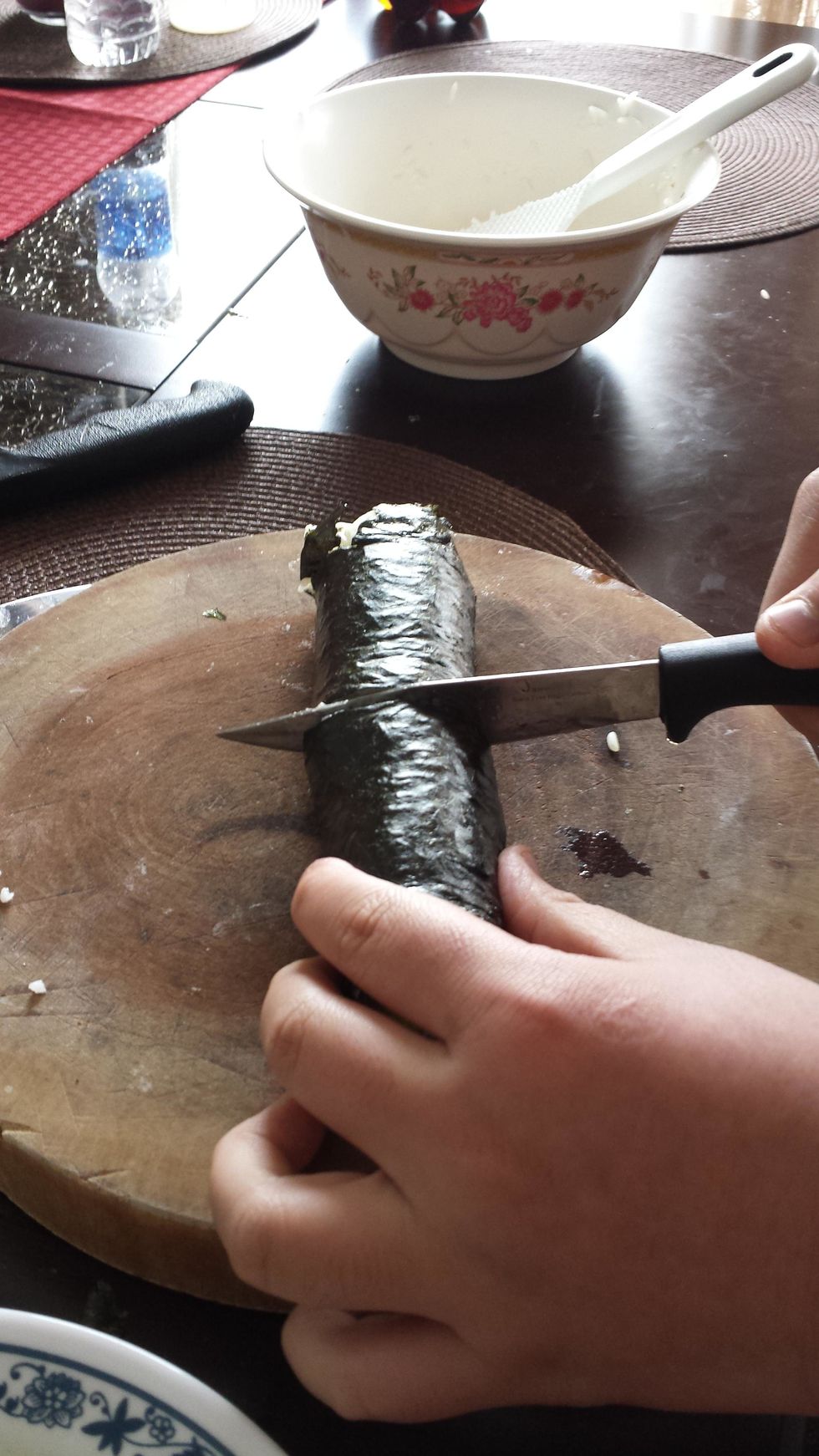 Next cut the sushi into bite size.