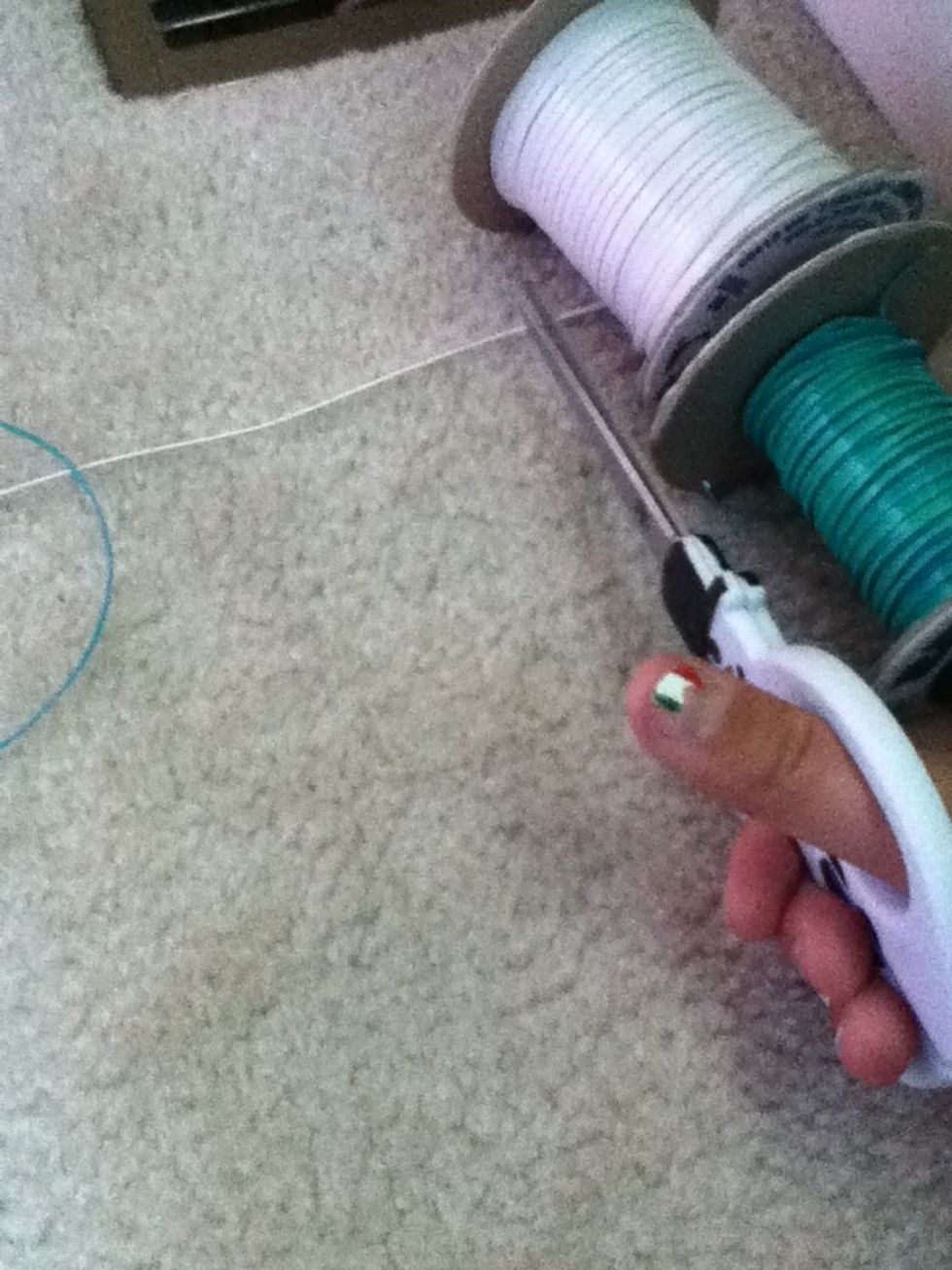 Next, cut to strings the same length. They can be how ever long you would like.