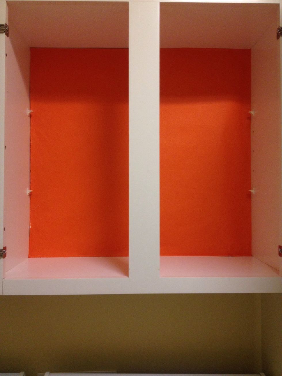 Next, cut your solid color wrapping paper to the interior dimensions. I attached the paper with artist's tape, but you could use masking tape.