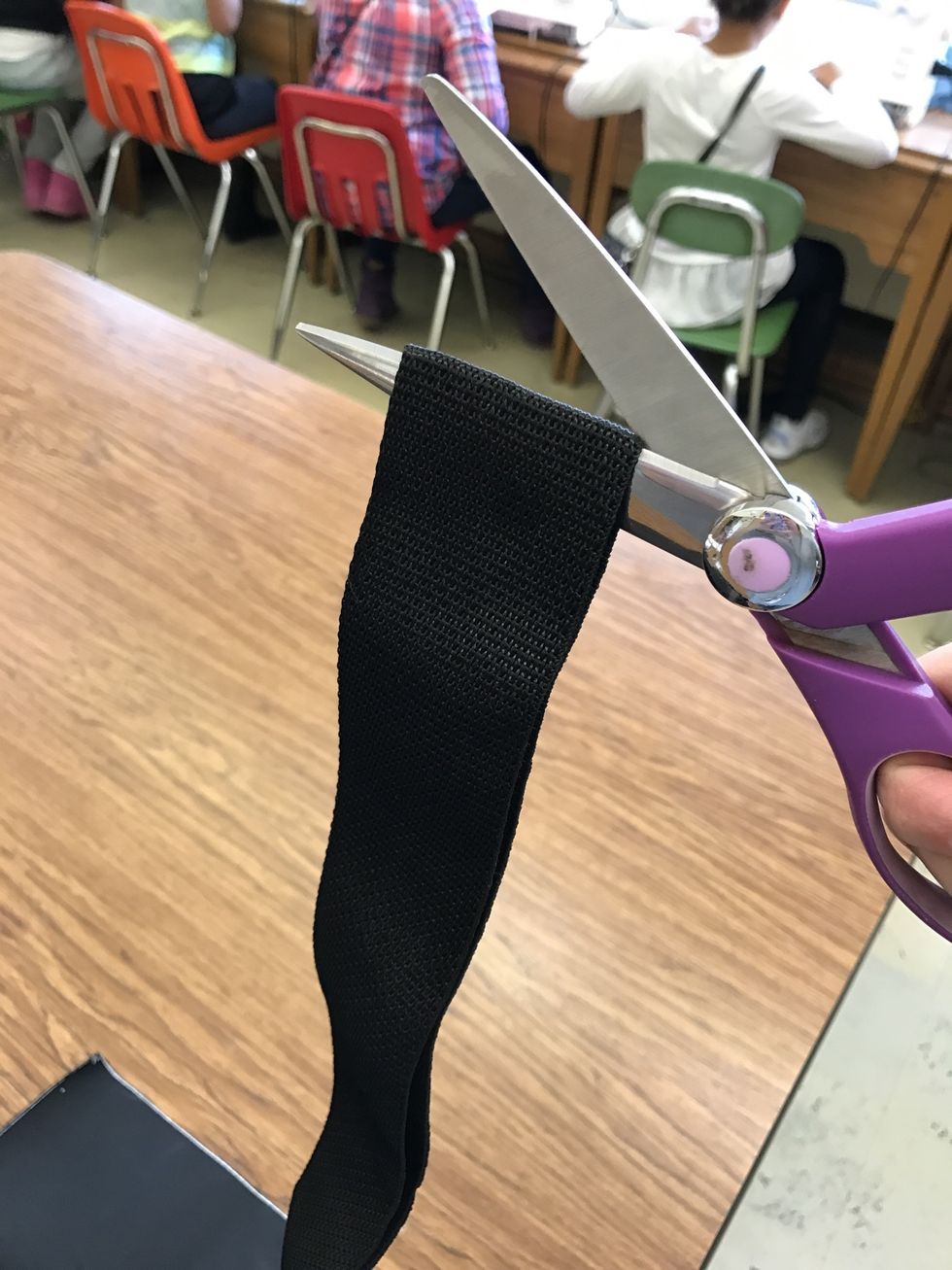 Next, cut your strap in half and burn the edges lightly to prevent fraying.