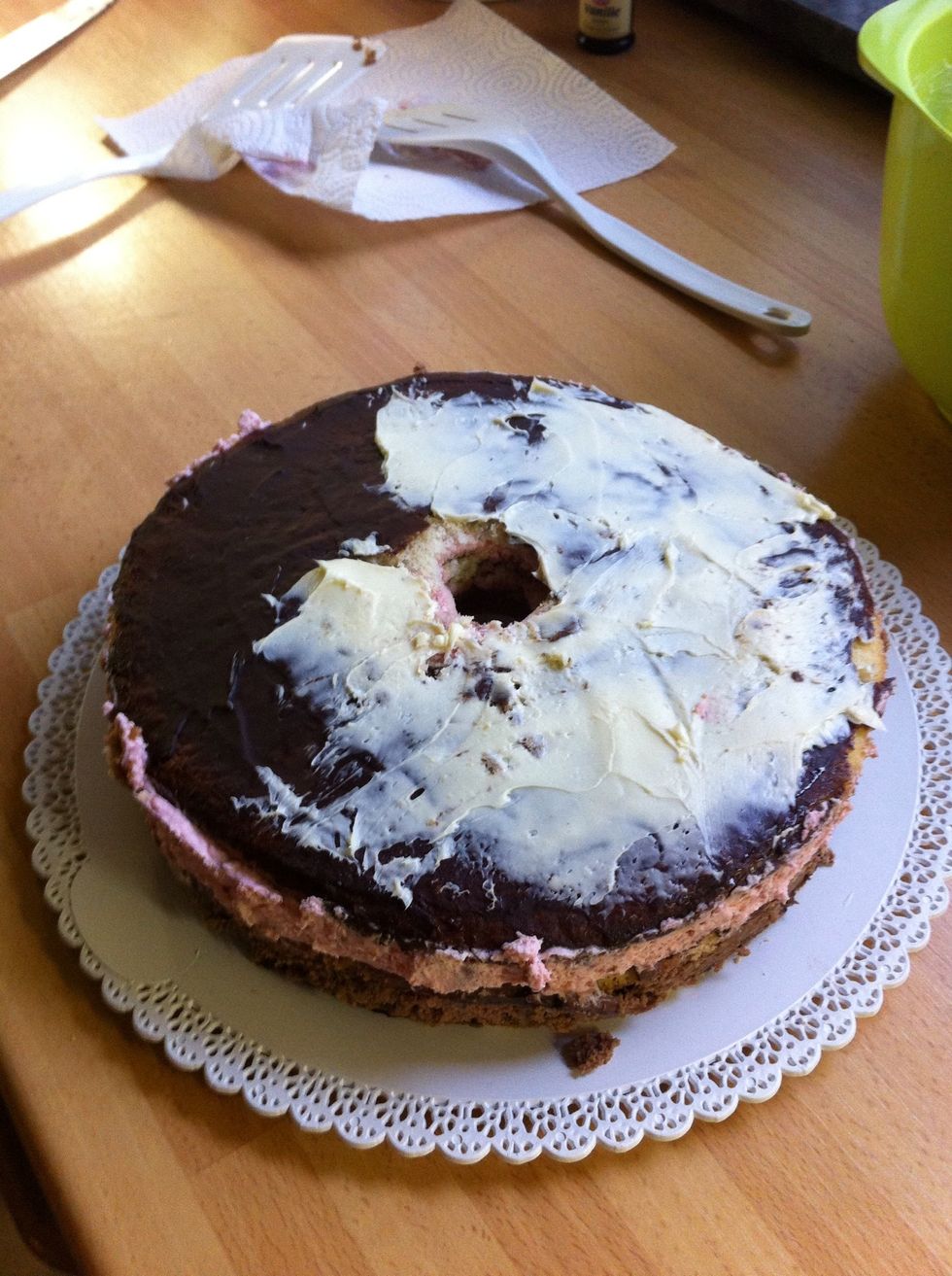 Next day, take the cakes out of the springform tins and spread the softened butter creme on top and sides. It is easier if you place the cakes on the serving trays at this step.