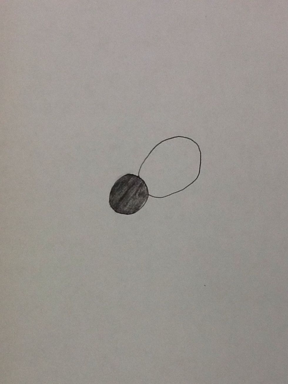 Next draw a bigger circle connected to the smaller circle.