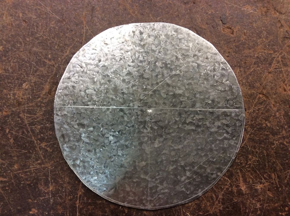 Next draw a circle in the metal with a scriber and then get some tin snips and cut it into a shape of a circle(x3).