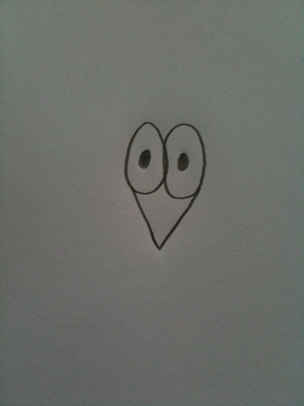 Next draw an arrow shape connected to the eyes like so.