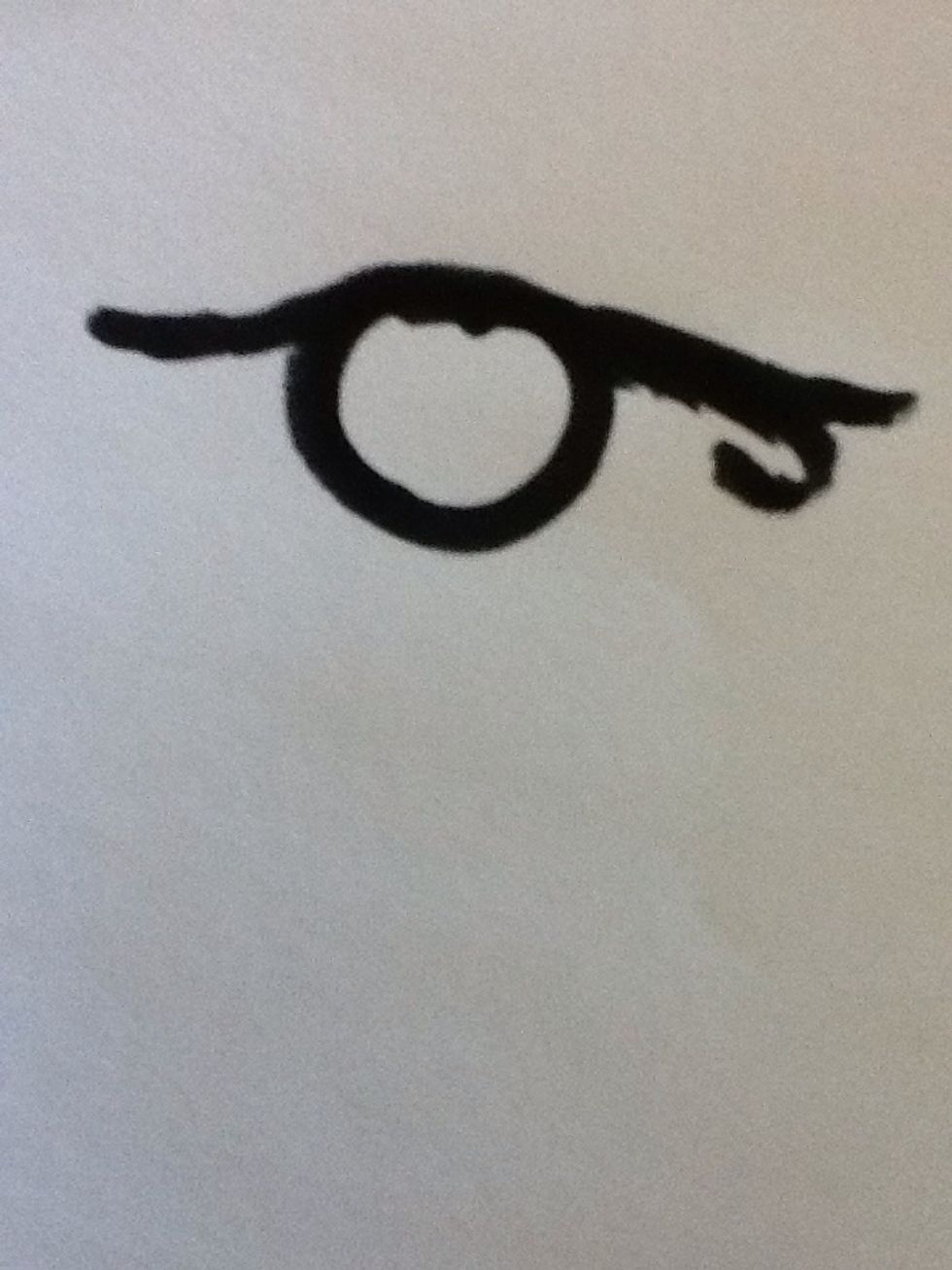 Next, draw in the very thick eye lid line and shape,