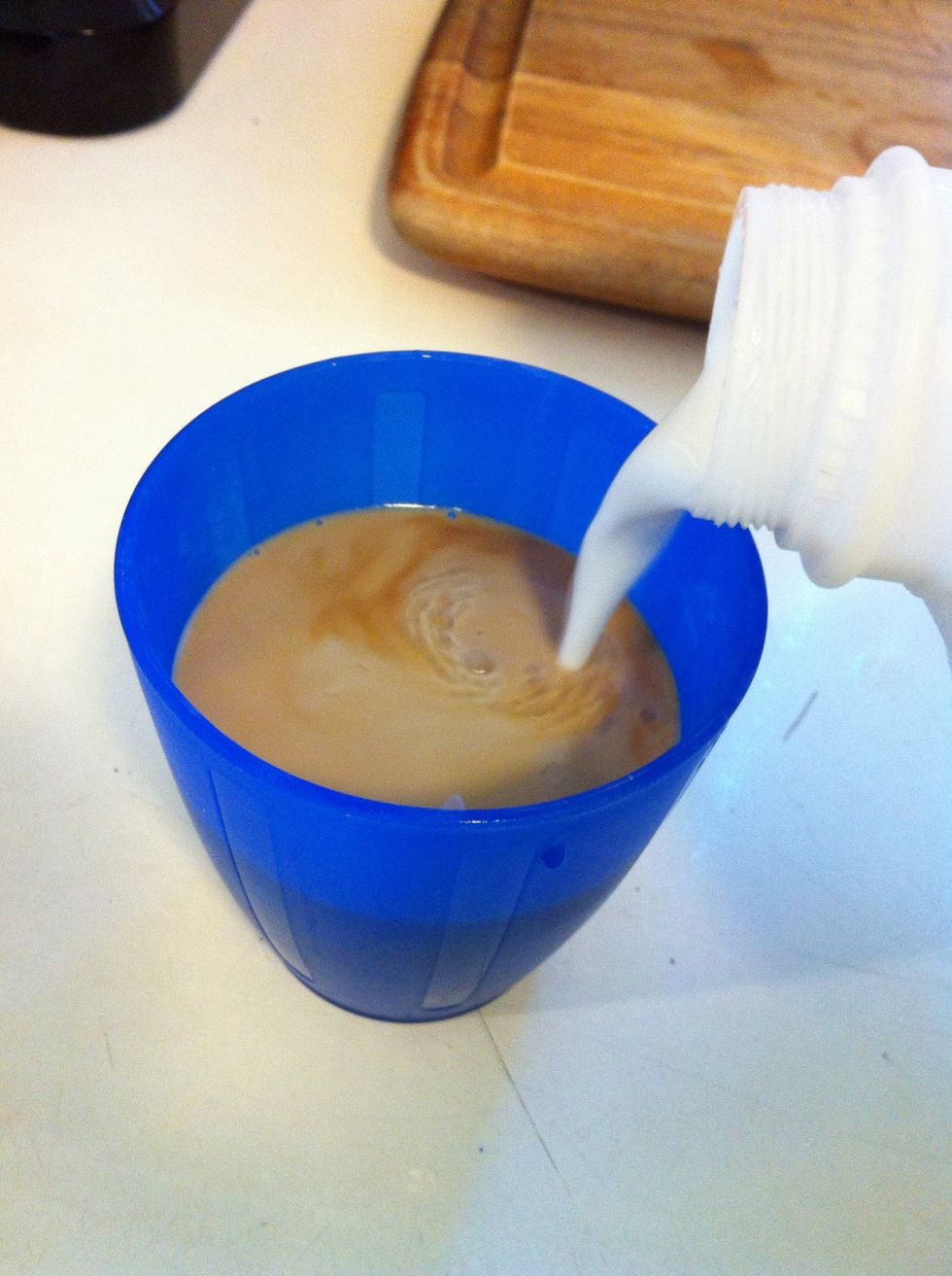 Next fill the rest of the cup with milk and add to blender
