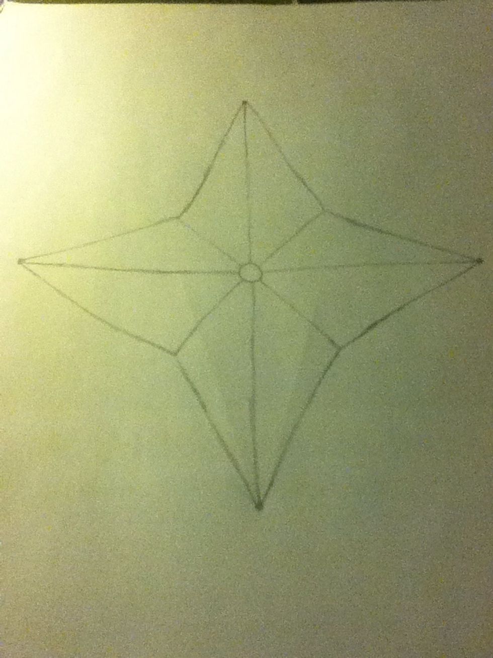 Next find where the corners of the triangles meet, draw four diagonal lines and connect them to the circle. This should divide your star into 8 parts.