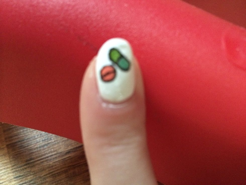 Next finger gets colorful pills that I outlined in black polish \ud83d\udc8a