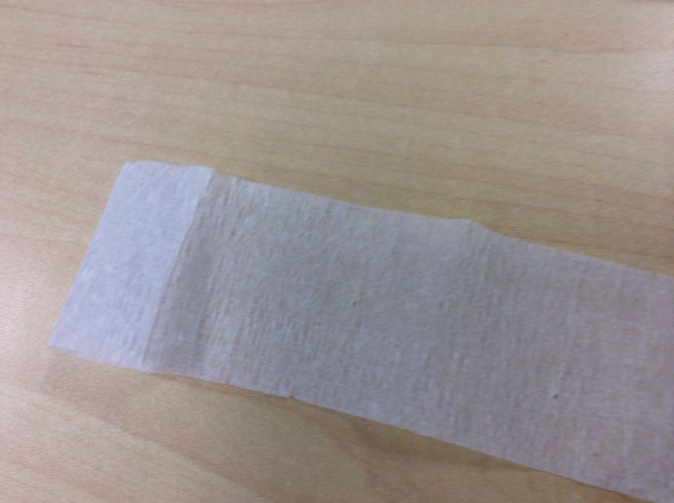 Next , fold a little bit of the tissue paper .