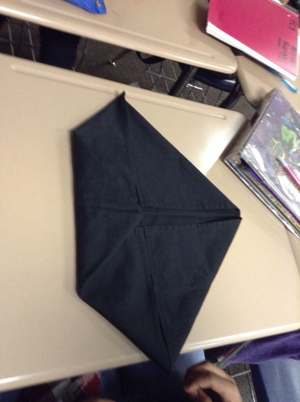Next, fold corner towards the center