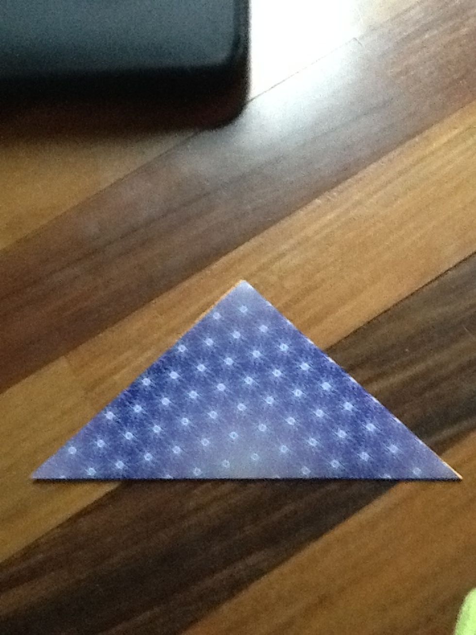 Next fold in half, so it is a triangle.