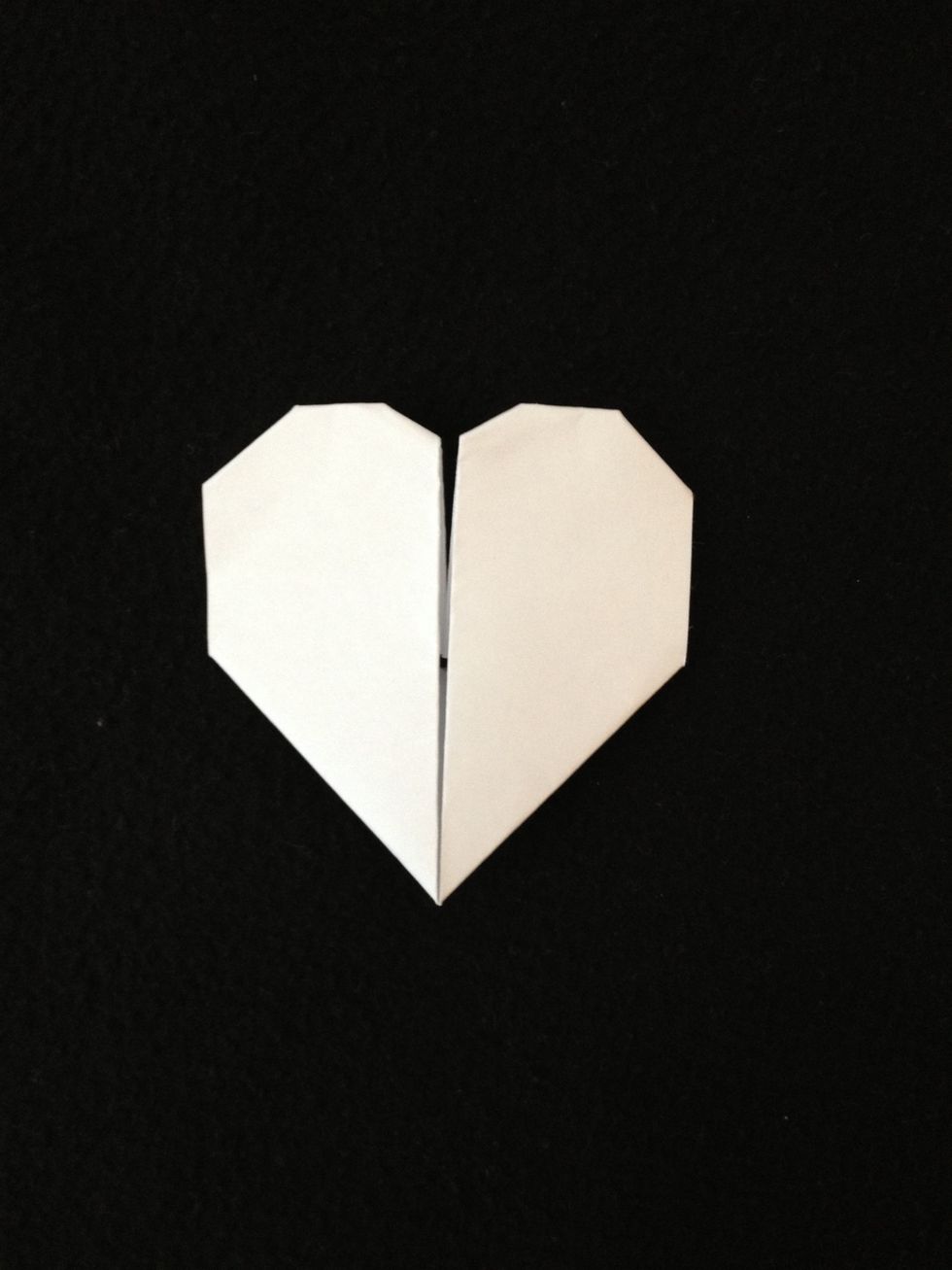 Next fold in the two inside corners and now your done. One simple paper heart.