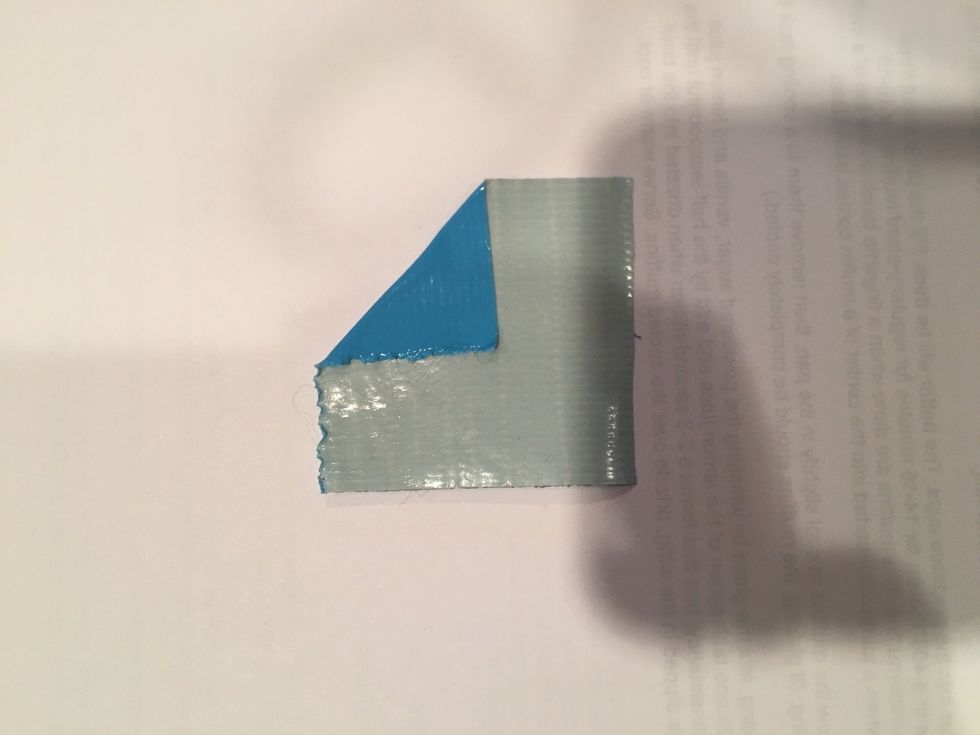 next fold one corner of the square down to form half of a triangle